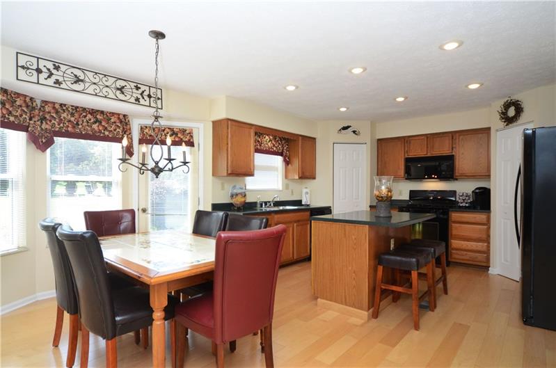 4 Wellington Court McKees Rocks, PA 15136 - Photo 6 of 24 LARGE EAT-IN KITCHEN WITH BAYED BREAKFAST ROOM, AND NEW HARDWOOD FLOORS