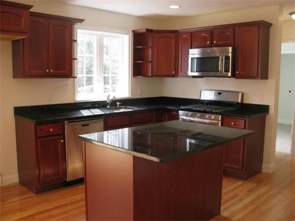 162 Leslie Road Rowley, MA 01969 - Photo 3 of 17 a kitchen with a sink and a microwave