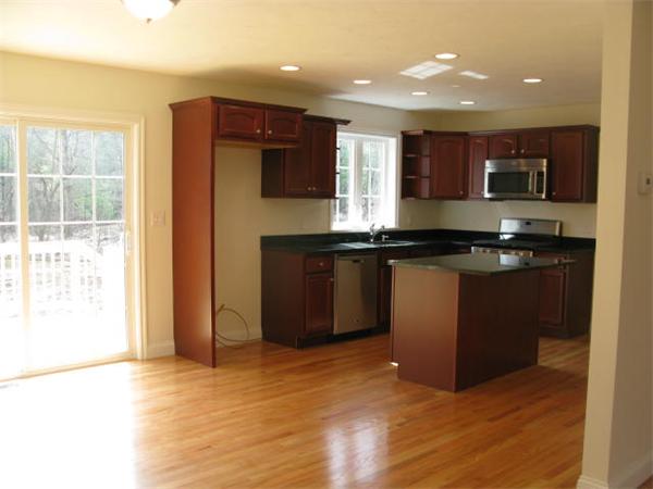 162 Leslie Road Rowley, MA 01969 - Photo 7 of 17 a kitchen with stainless steel appliances granite countertop a stove a sink a refrigerator and a microwave