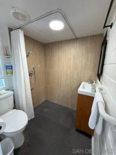 a bathroom with a toilet and a sink