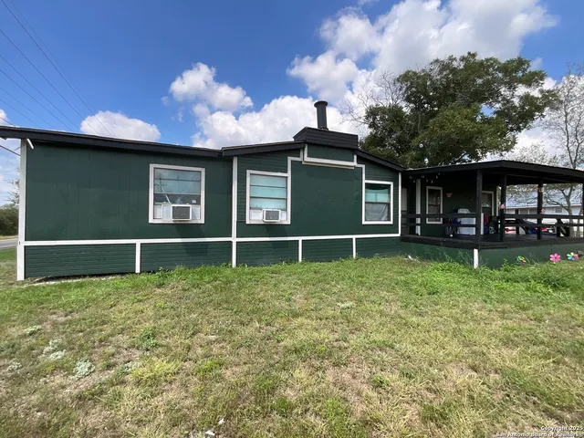 a house with garden in front of it