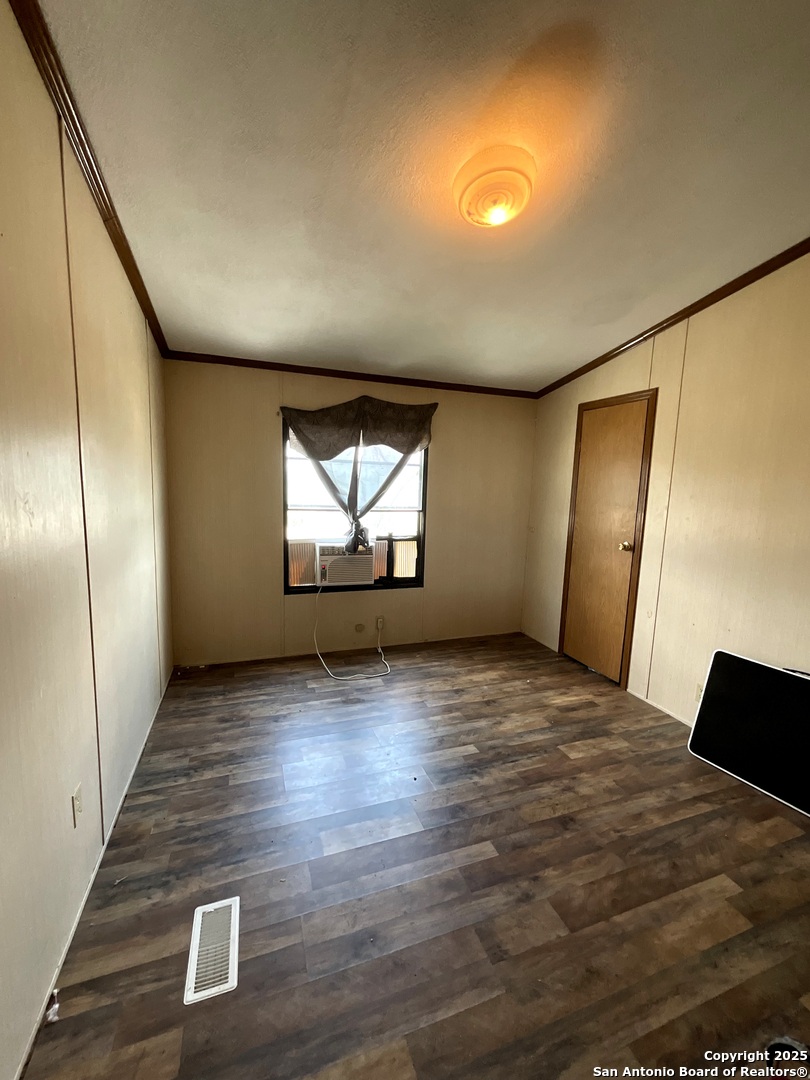 1 3rd Street Pettus, TX 78146 - Photo 11 of 16 a view of empty room with wooden floor