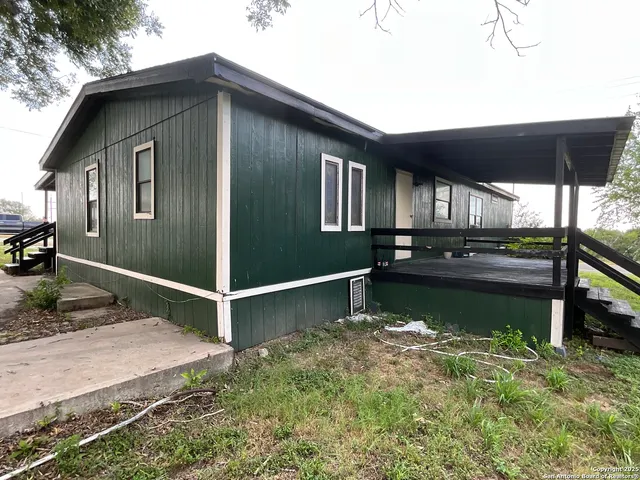 a front view of a house with swimming pool