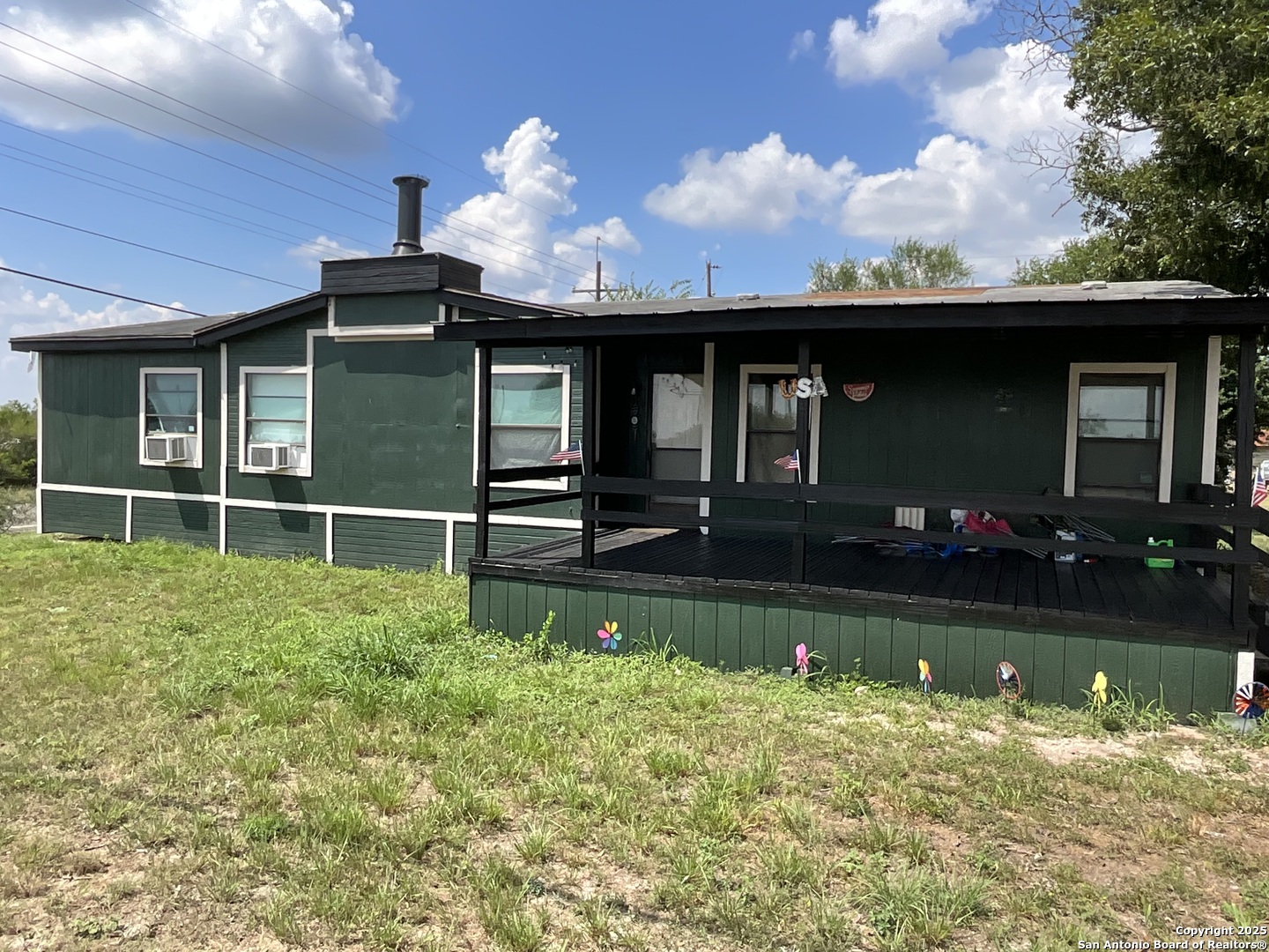 1 3rd Street Pettus, TX 78146 - Photo 7 of 16 a front view of a house with a yard table and chairs