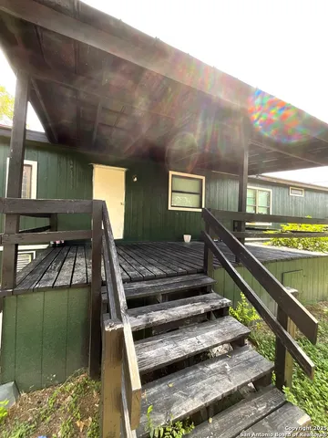 a view of a balcony with chairs
