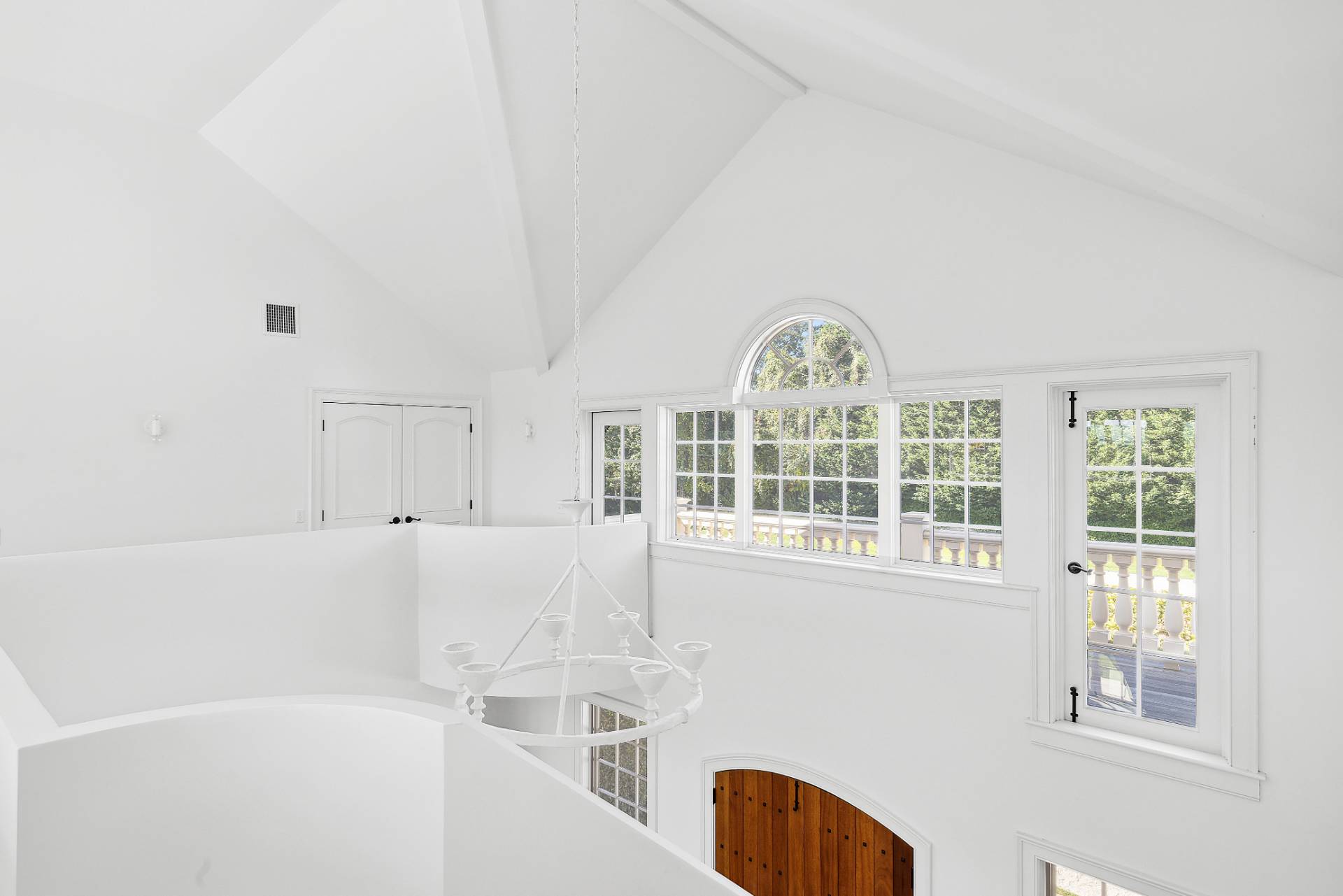 17 Jordan Drive Water Mill, NY 11976 - Photo 11 of 25 a view of a bedroom with a bed and a large window