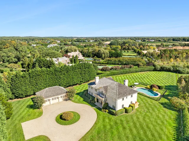 an aerial view of a house with garden space and outdoor space
