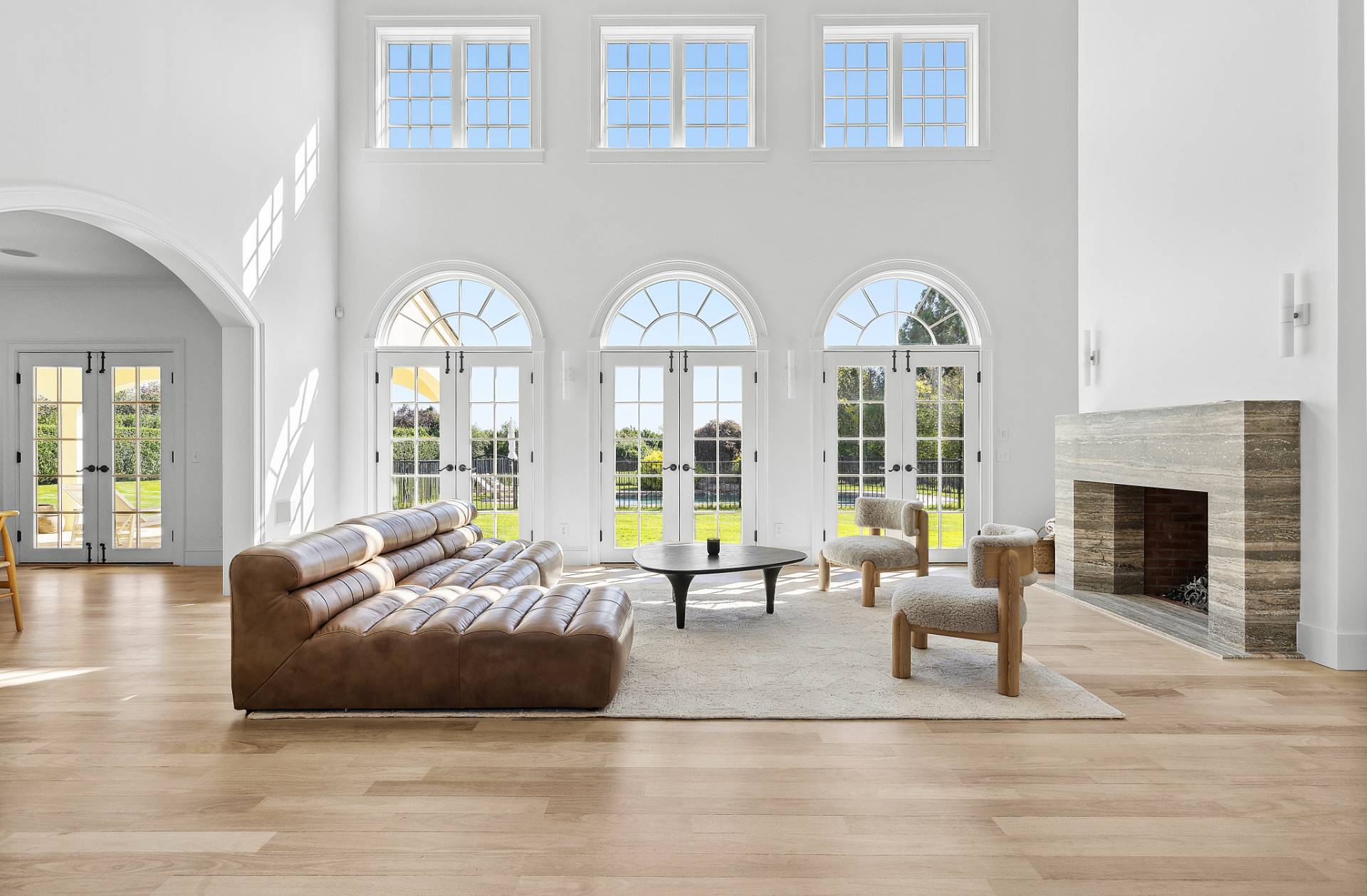 17 Jordan Drive Water Mill, NY 11976 - Photo 6 of 25 a living room with furniture large window and a fireplace