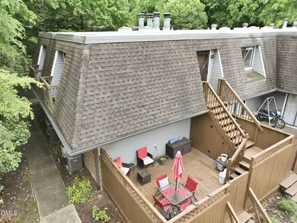 aerial view of a house with a yard and a garden