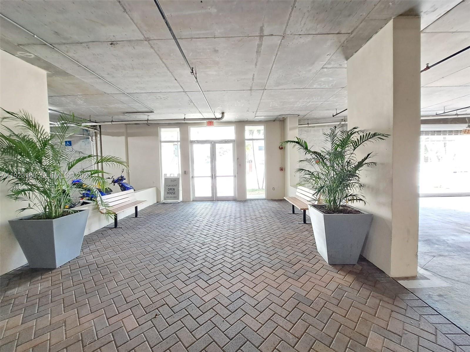 120 Southwest 8th Avenue, Unit 802 Miami, FL 33130 - Photo 23 of 30 a view of living room filled with furniture and potted plant
