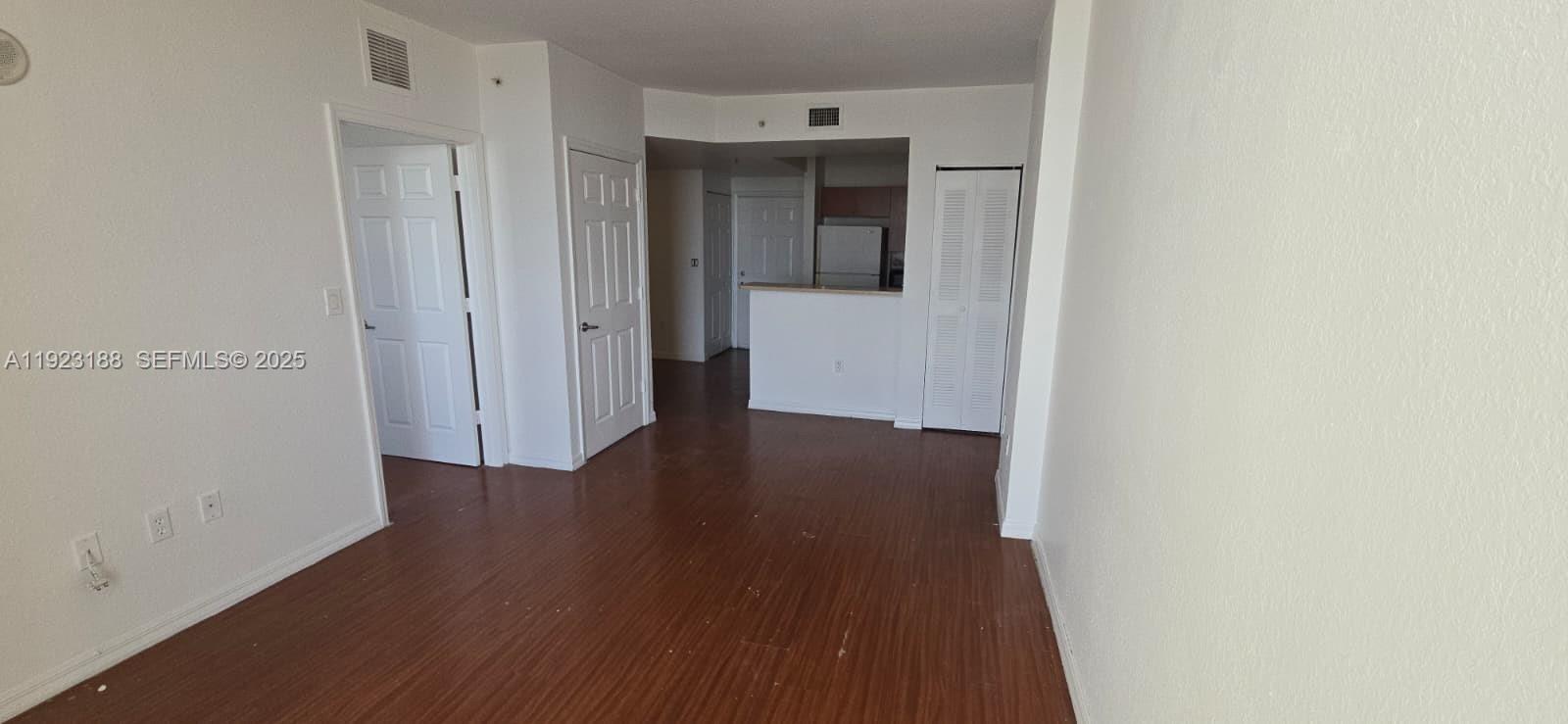 120 Southwest 8th Avenue, Unit 802 Miami, FL 33130 - Photo 25 of 31 a view of a hallway with wooden floor
