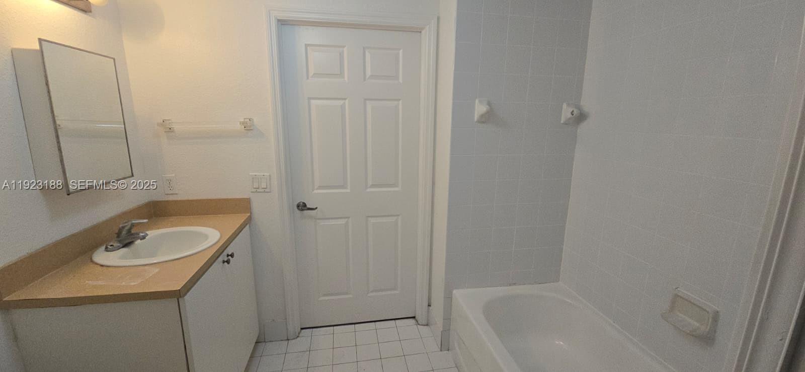 120 Southwest 8th Avenue, Unit 802 Miami, FL 33130 - Photo 30 of 31 a bath room with a sink and a tub