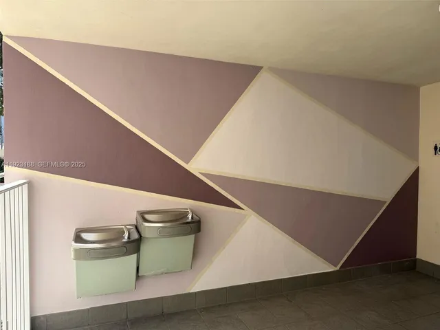 a view of an empty room with many windows