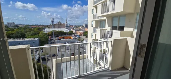 a view of balcony with furniture