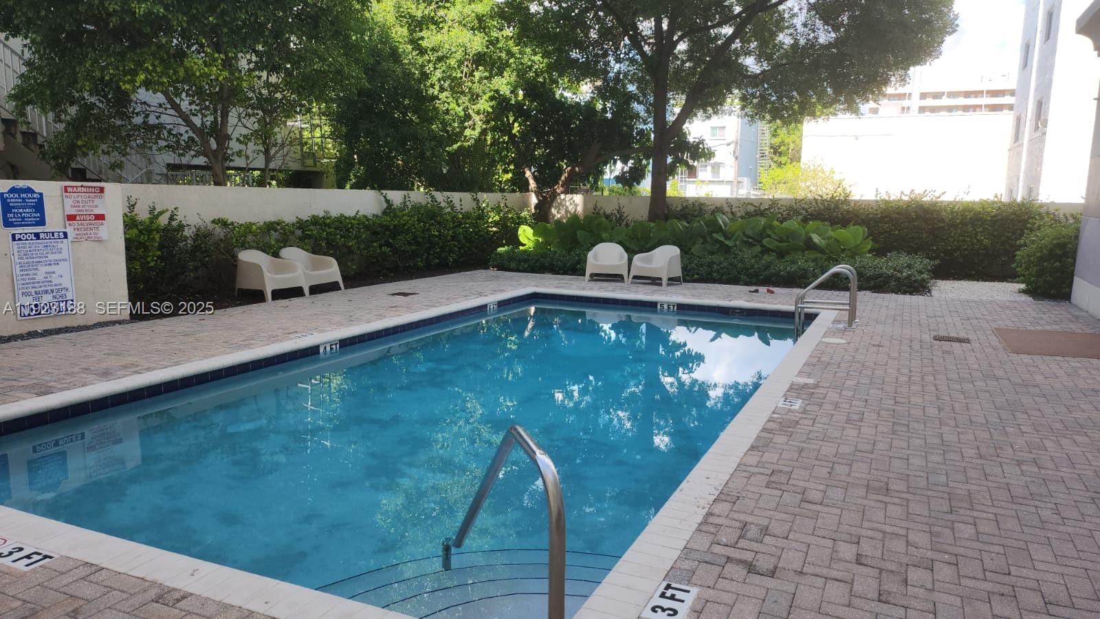 120 Southwest 8th Avenue, Unit 802 Miami, FL 33130 - Photo 8 of 31 a view of swimming pool with a patio