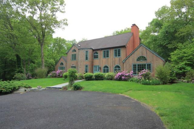 163 Peaceable Hill Road Ridgefield, CT 06877 - Photo 1 of 1 a house view with a garden space