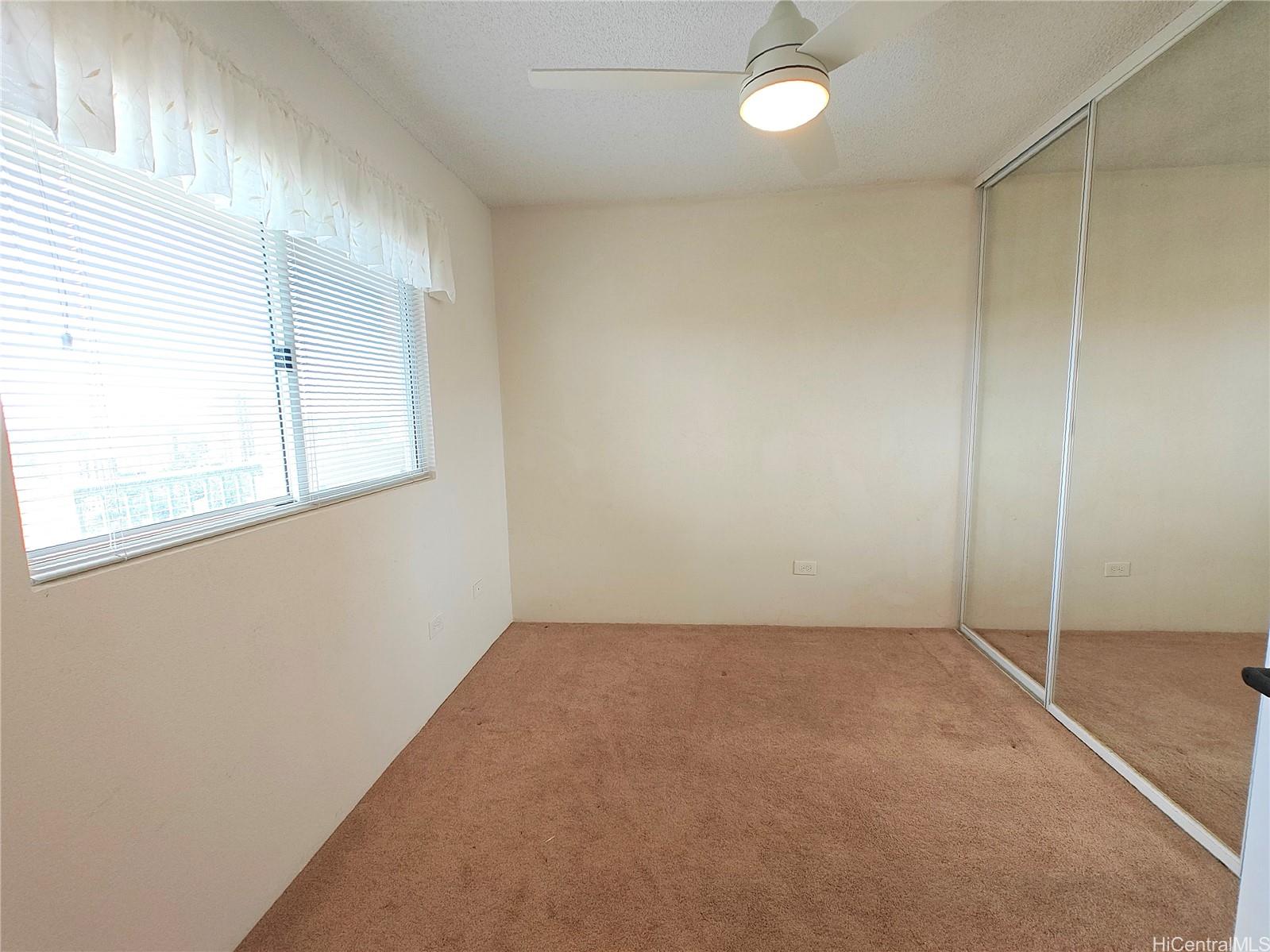 3054 Ala Poha Place, Unit 2005 Honolulu, HI 96818 - Photo 15 of 22 an empty room with windows
