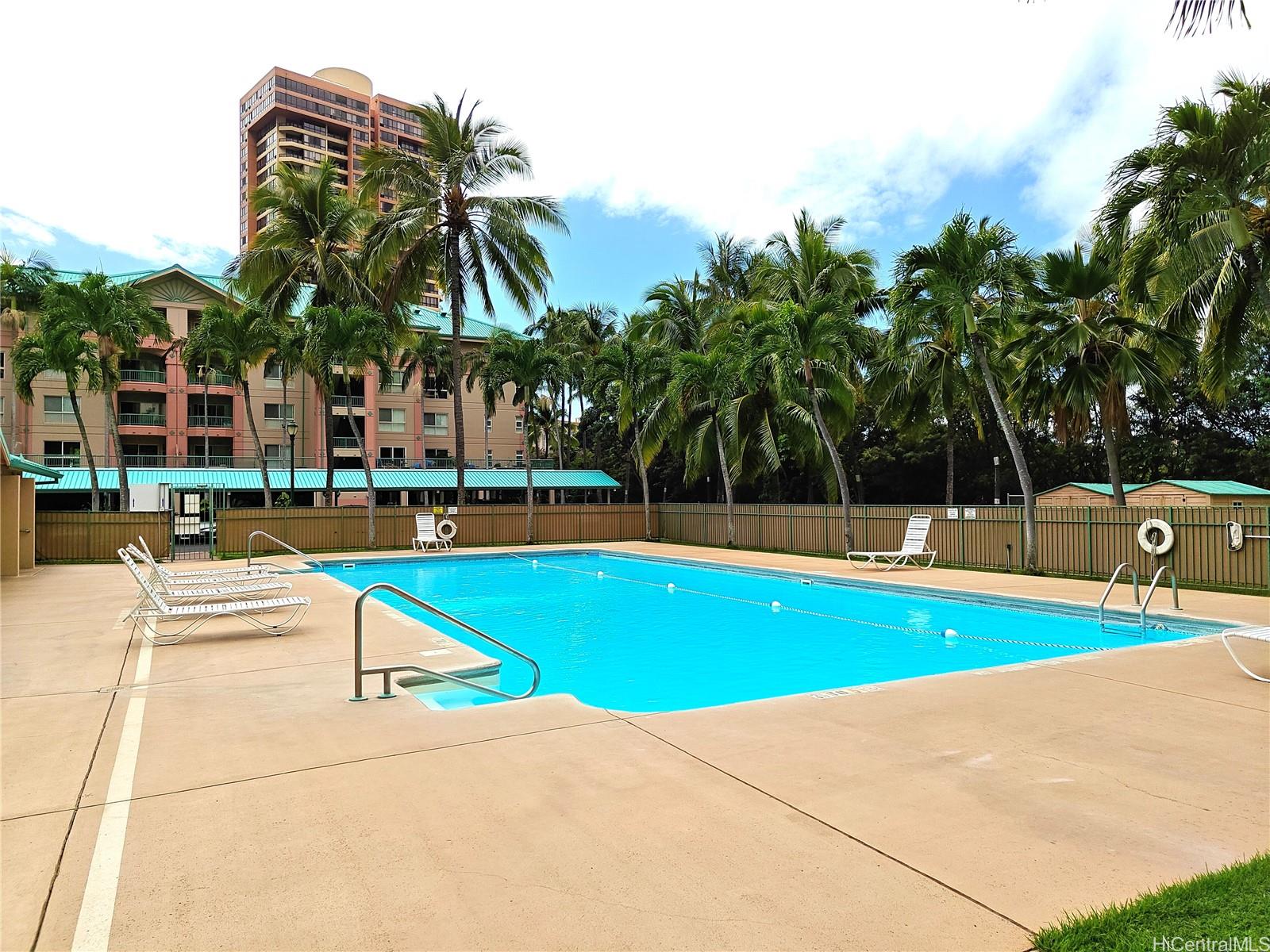 3054 Ala Poha Place, Unit 2005 Honolulu, HI 96818 - Photo 22 of 22 a view of swimming pool with chairs