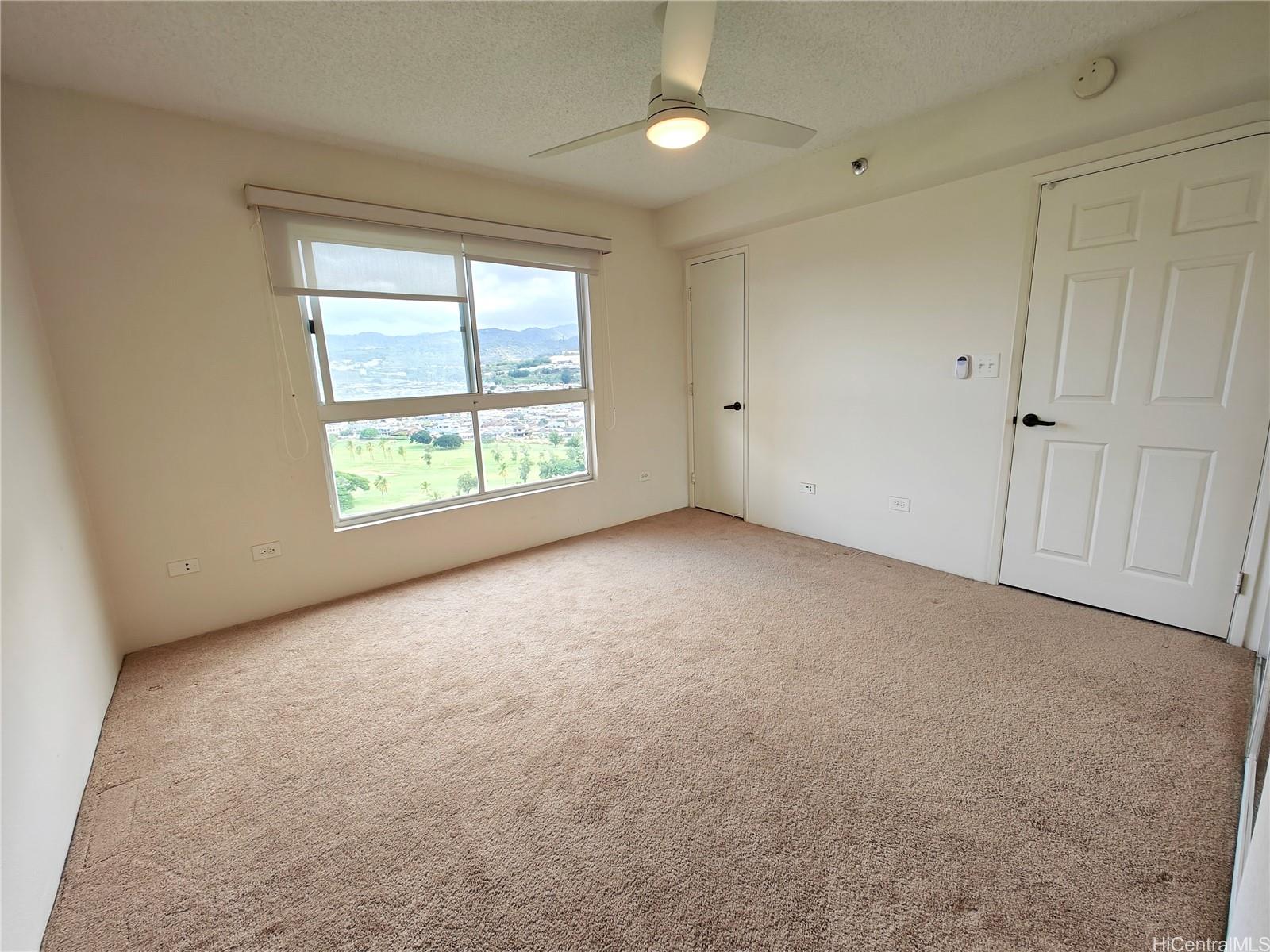 3054 Ala Poha Place, Unit 2005 Honolulu, HI 96818 - Photo 9 of 22 an empty room with windows