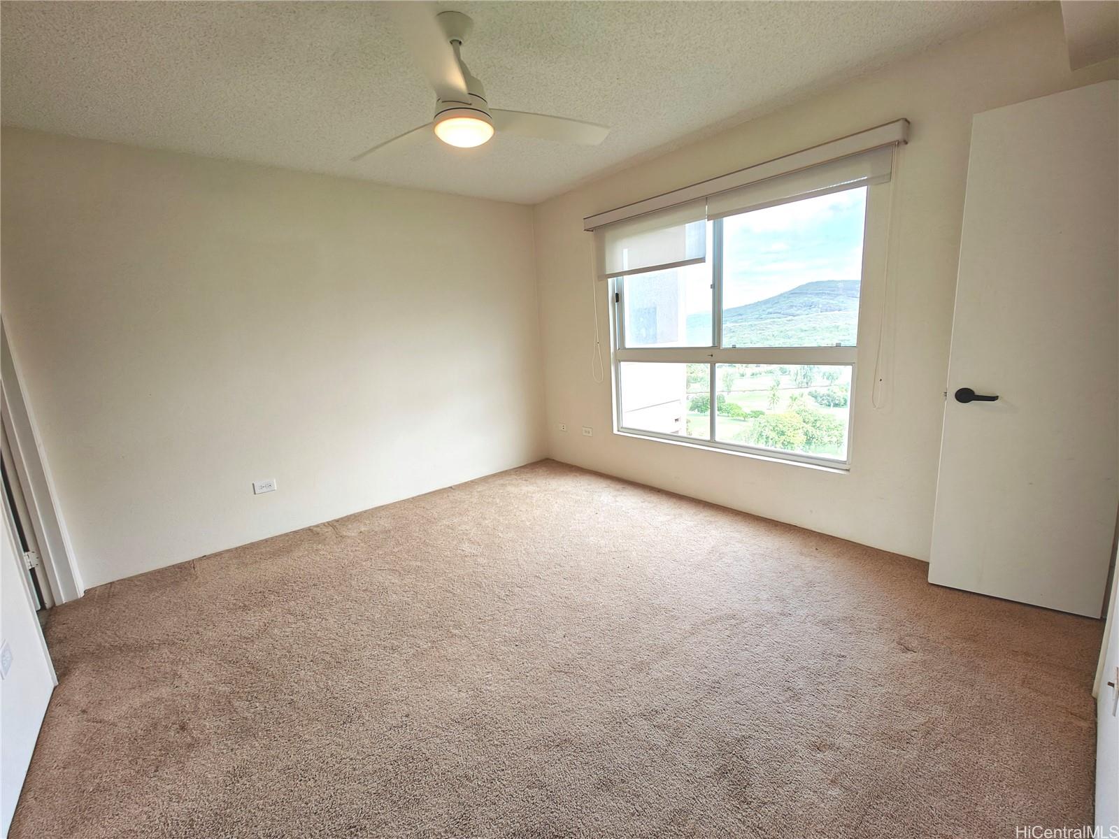 3054 Ala Poha Place, Unit 2005 Honolulu, HI 96818 - Photo 10 of 22 an empty room with windows