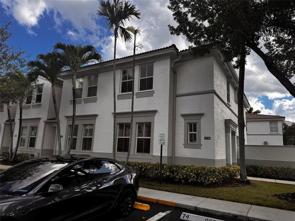 15746 Southwest 41st Street Miramar, FL 33027 - Photo 1 of 20 a car parked in front of a house
