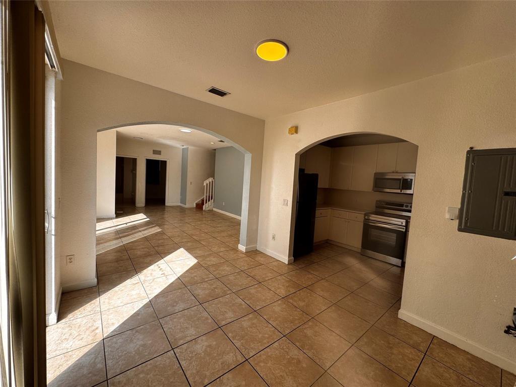 15746 Southwest 41st Street Miramar, FL 33027 - Photo 6 of 20 a view of a livingroom with a staircase