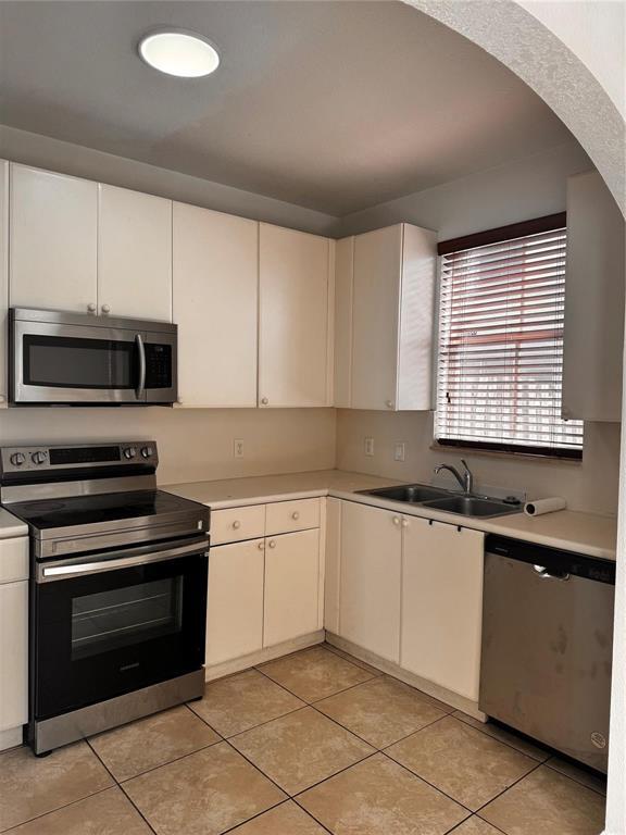 15746 Southwest 41st Street Miramar, FL 33027 - Photo 8 of 20 a kitchen with granite countertop cabinets stainless steel appliances and a sink