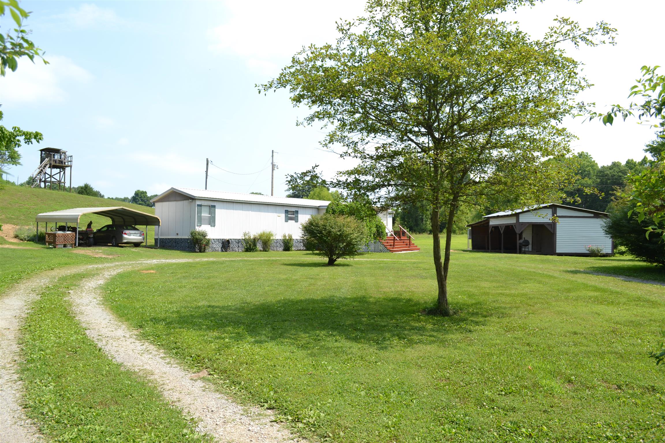 120 Rankin Road Hartsville, TN 37074 - Photo 1 of 20 5 Beautiful and secluded acres with 3 bed 2 bath maunfactured home on permanent foundation in Hartsville; has new roof and new water heater; has 2 car carport and workshop detached