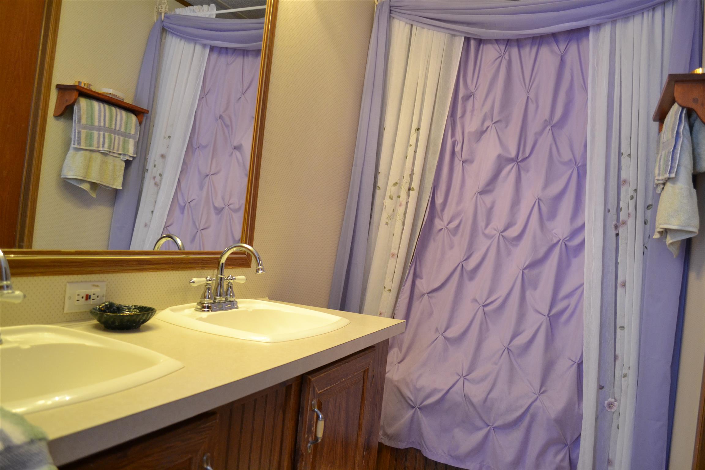 120 Rankin Road Hartsville, TN 37074 - Photo 12 of 20 MASTER BATH HAS GARDEN TUB/SHOWER COMBO; WITH VINYL TILE FLOOR; DOUBLE VANITIES