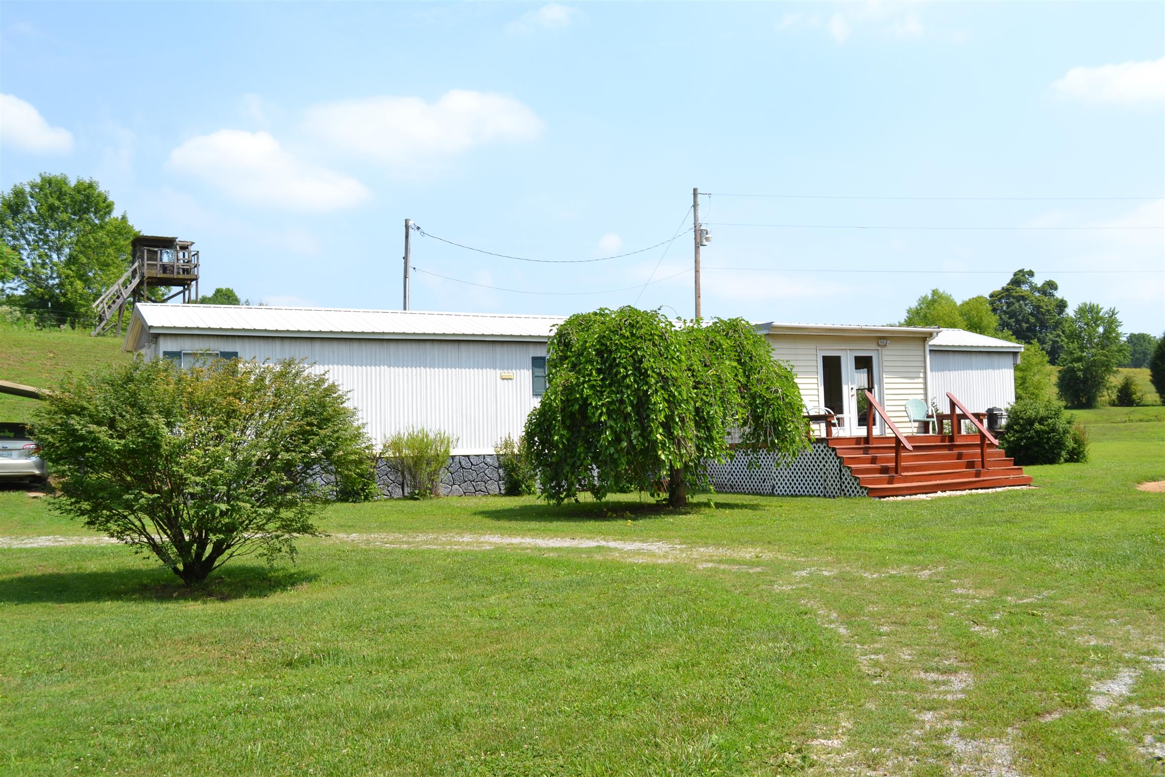 120 Rankin Road Hartsville, TN 37074 - Photo 18 of 20 HOME HAS DECK ON FRONT AND PORCH/DECK ON BACK OF HOUSE; WITH A LARGE ADDITION OF A REC ROOM; HAS HAS 3 BED 2 BATH WITH 2 CAR CA RPORT AND A WORKSHOP/SHED. THIS IS A MUST SEE!