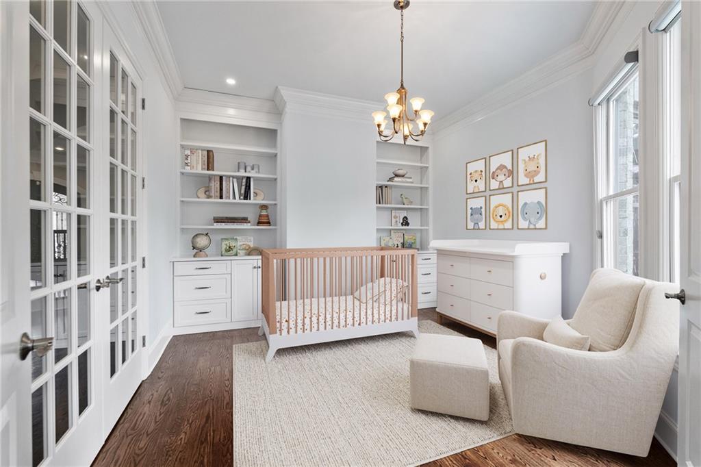 14560 Wood Road Milton, GA 30004 - Photo 25 of 74 a bedroom with furniture and a chandelier