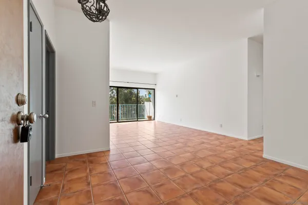a view of a livingroom with a hardwood floor and a sink
