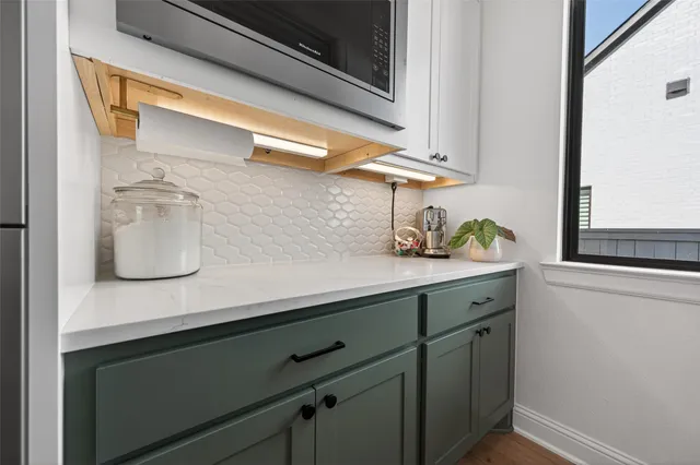 a kitchen with a sink and cabinets