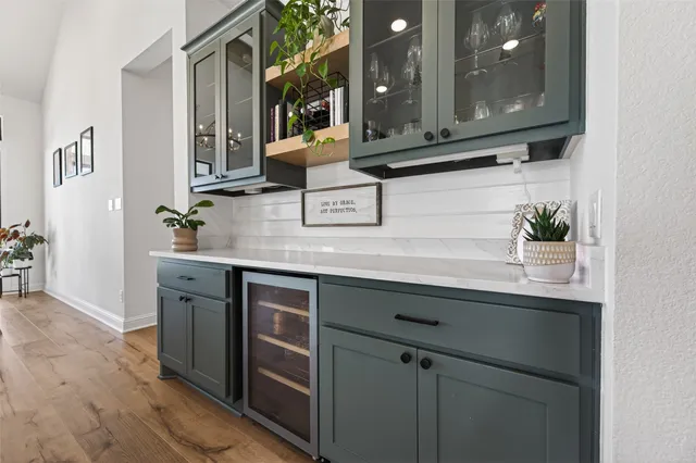 a kitchen with stainless steel appliances granite countertop a sink and a microwave
