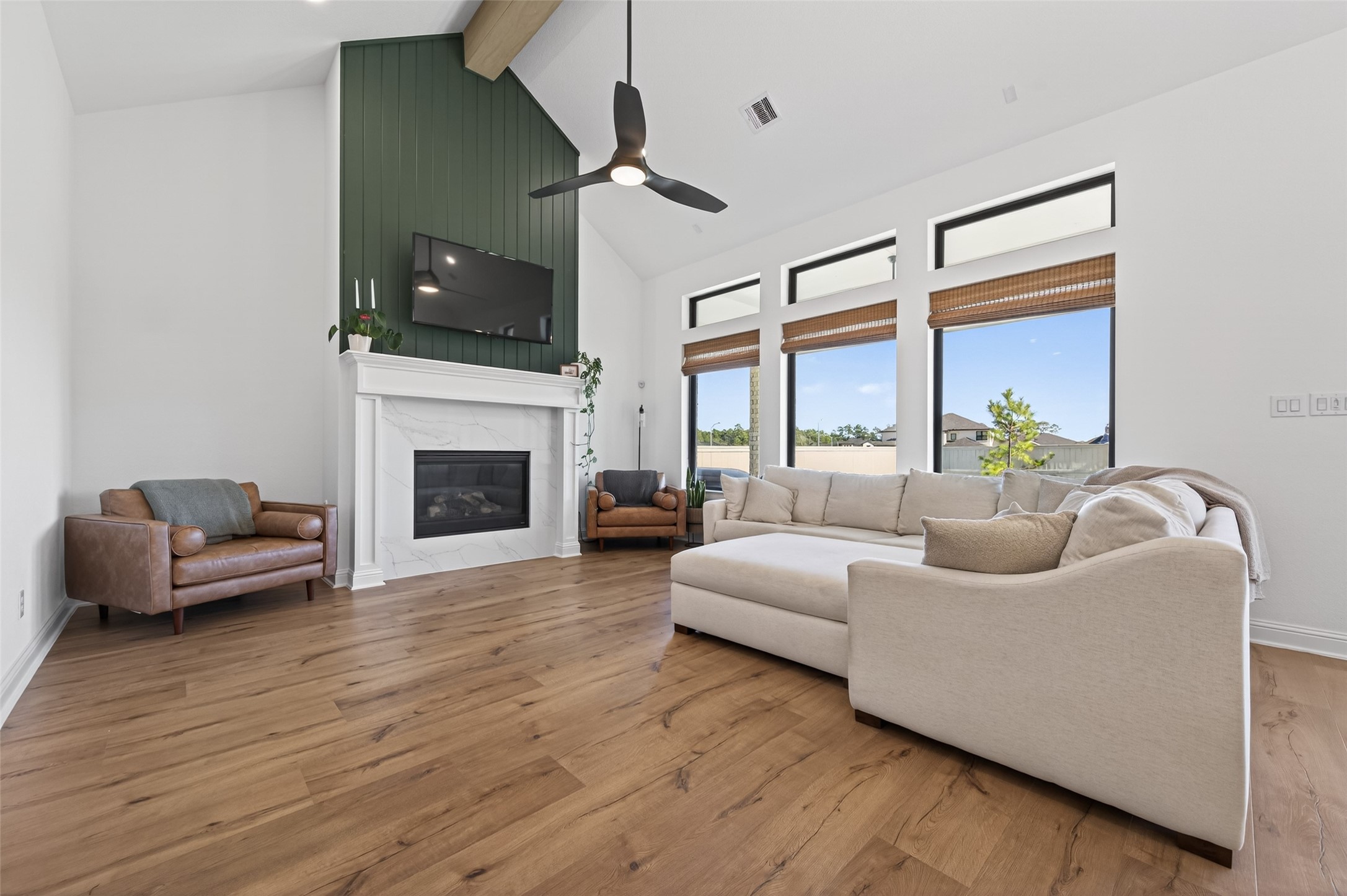 175 Shoveler Duck Way Magnolia, TX 77354 - Photo 17 of 47 a living room with furniture a flat screen tv and a fireplace