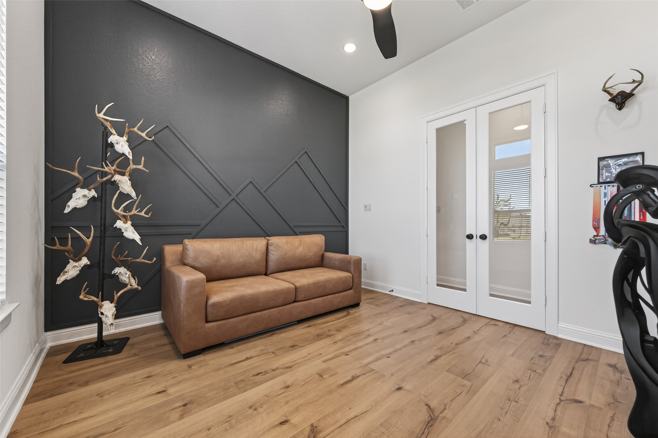 175 Shoveler Duck Way Magnolia, TX 77354 - Photo 21 of 47 a living room with furniture and a wooden floor