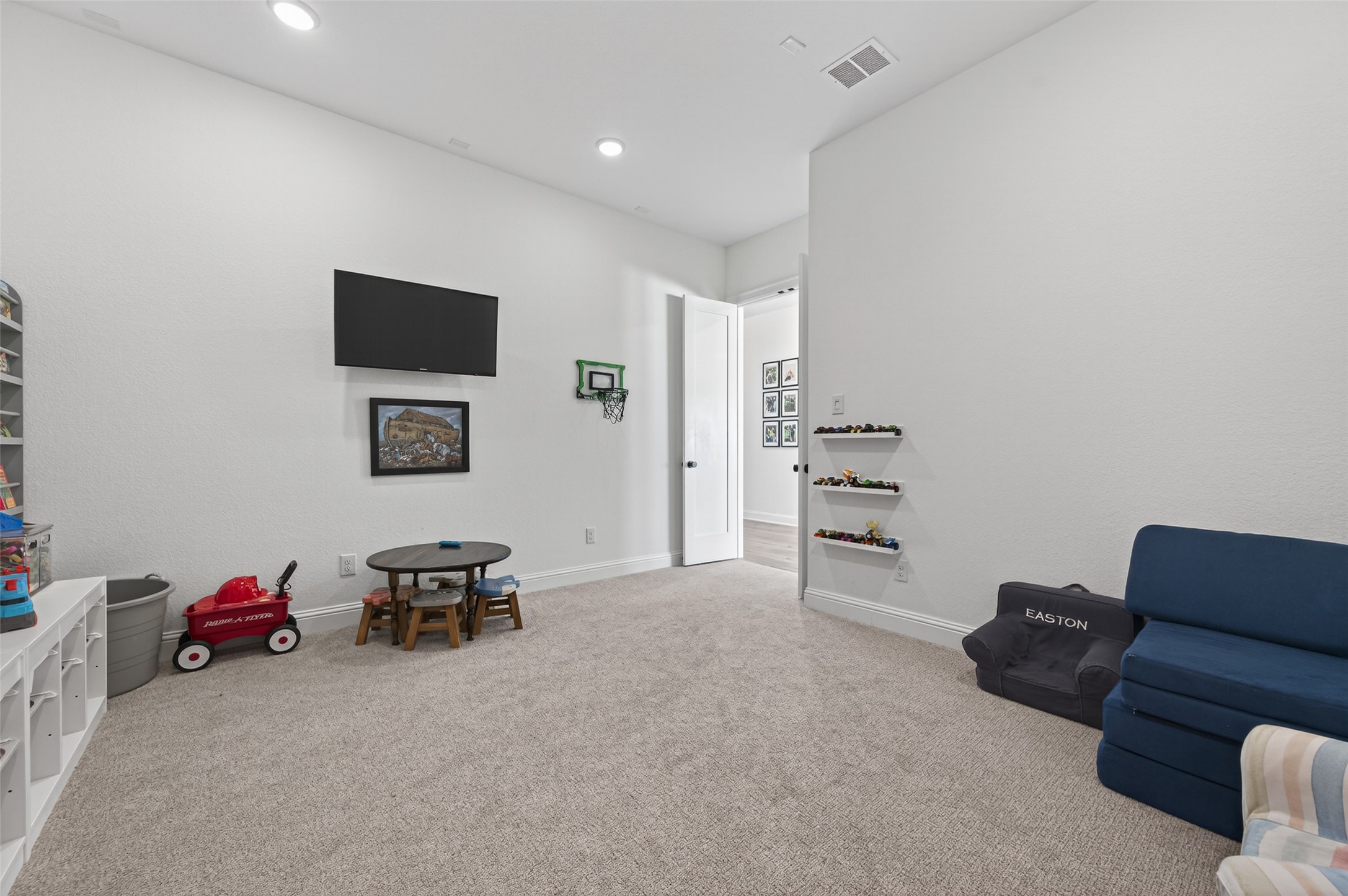 175 Shoveler Duck Way Magnolia, TX 77354 - Photo 31 of 47 a living room with furniture and a flat screen tv