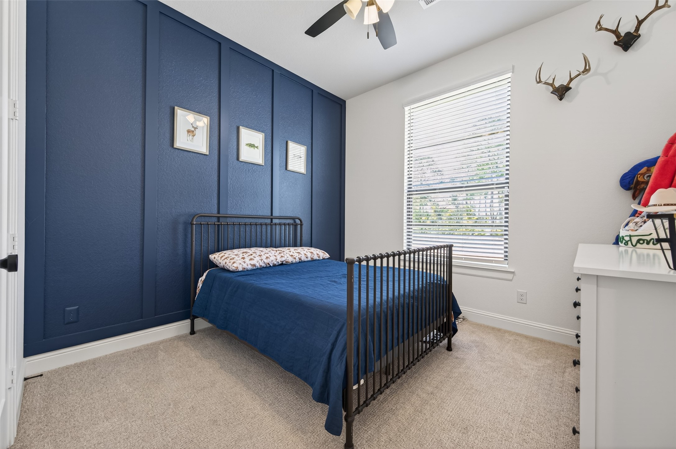 175 Shoveler Duck Way Magnolia, TX 77354 - Photo 39 of 47 a bed sitting in a bedroom next to a window