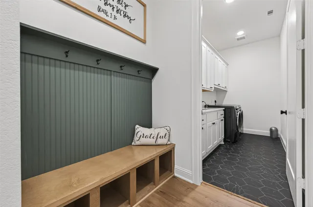 a bed sitting in a bedroom next to a window with outer view