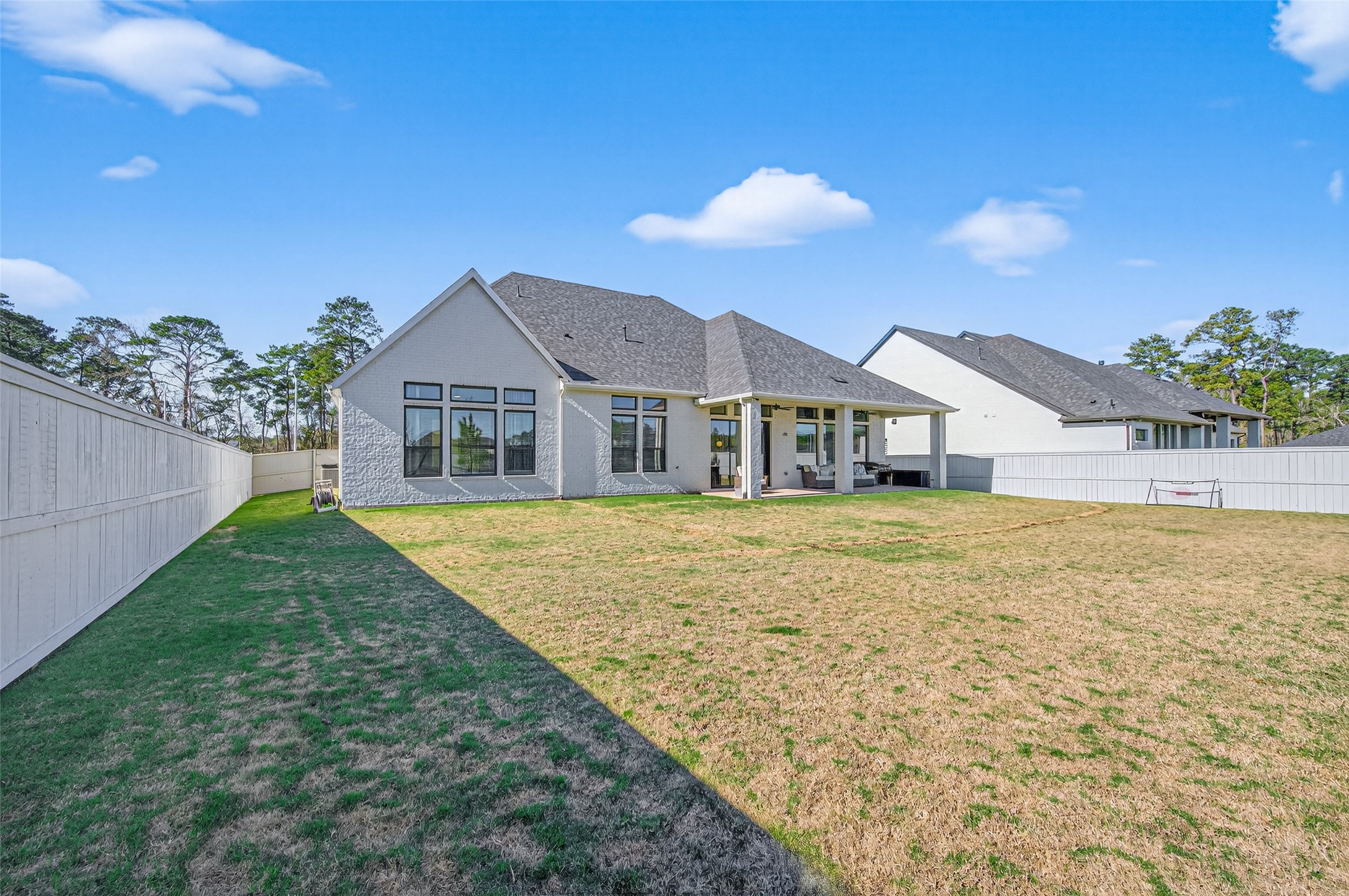 175 Shoveler Duck Way Magnolia, TX 77354 - Photo 46 of 47 a house with green field in front of it