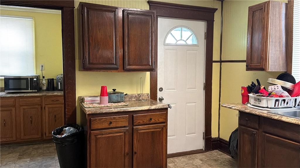 304 Spruce Avenue Sharon, PA 16146 - Photo 8 of 12 a kitchen with a refrigerator and a stove top oven