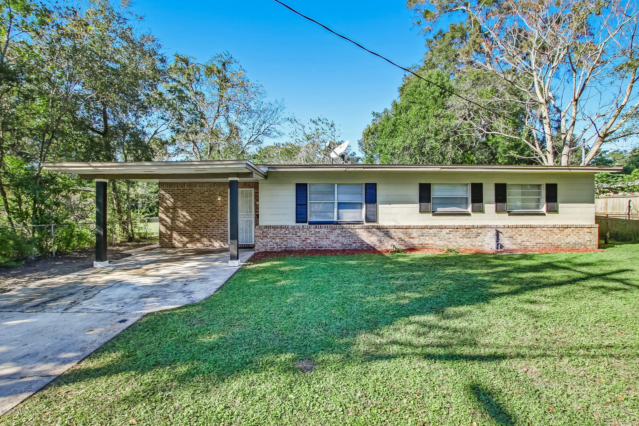 6815 King Arthur Road Jacksonville, FL 32211 - Photo 1 of 32 front view of a house with a yard