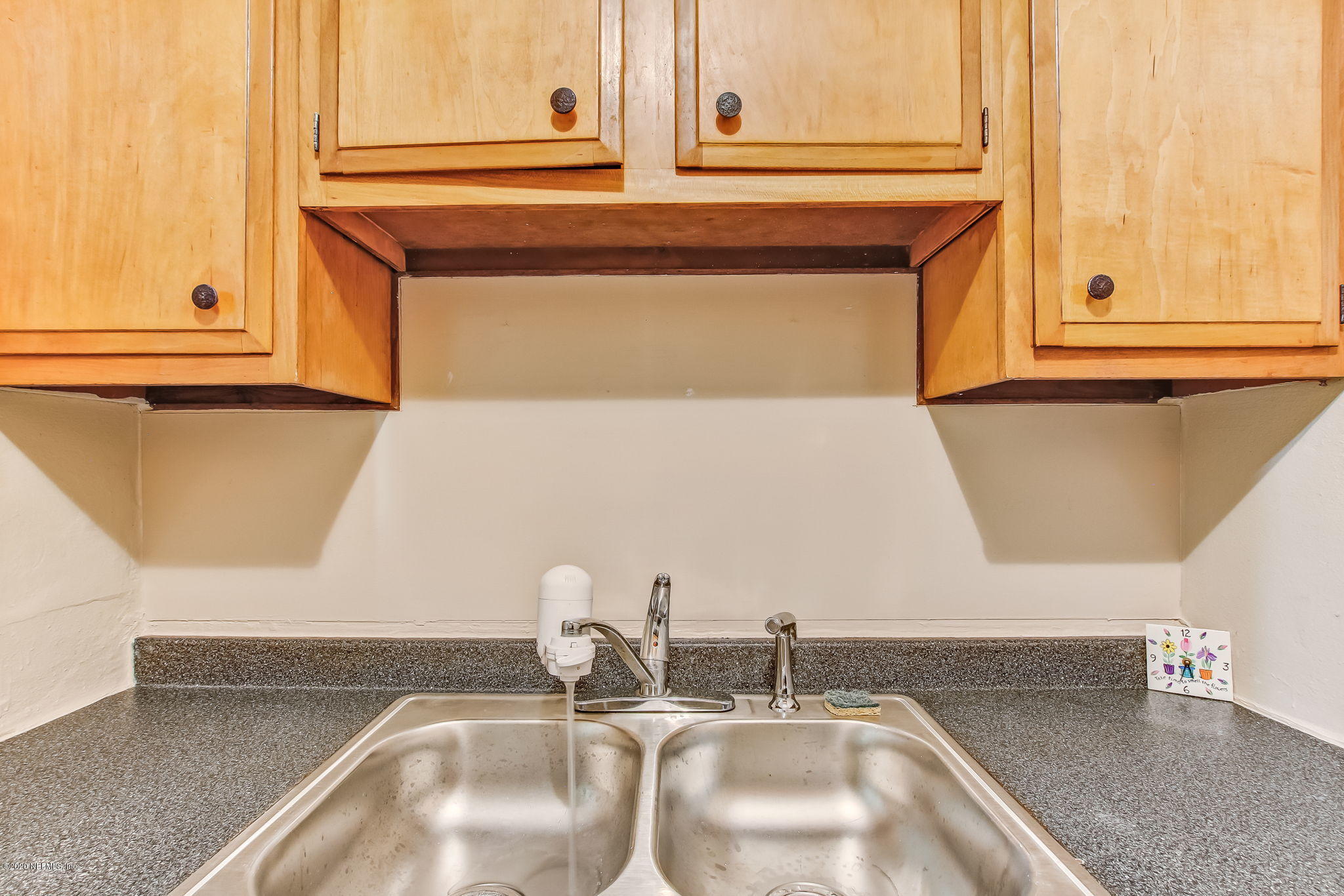 6815 King Arthur Road Jacksonville, FL 32211 - Photo 12 of 32 a bathroom with a sink and a mirror