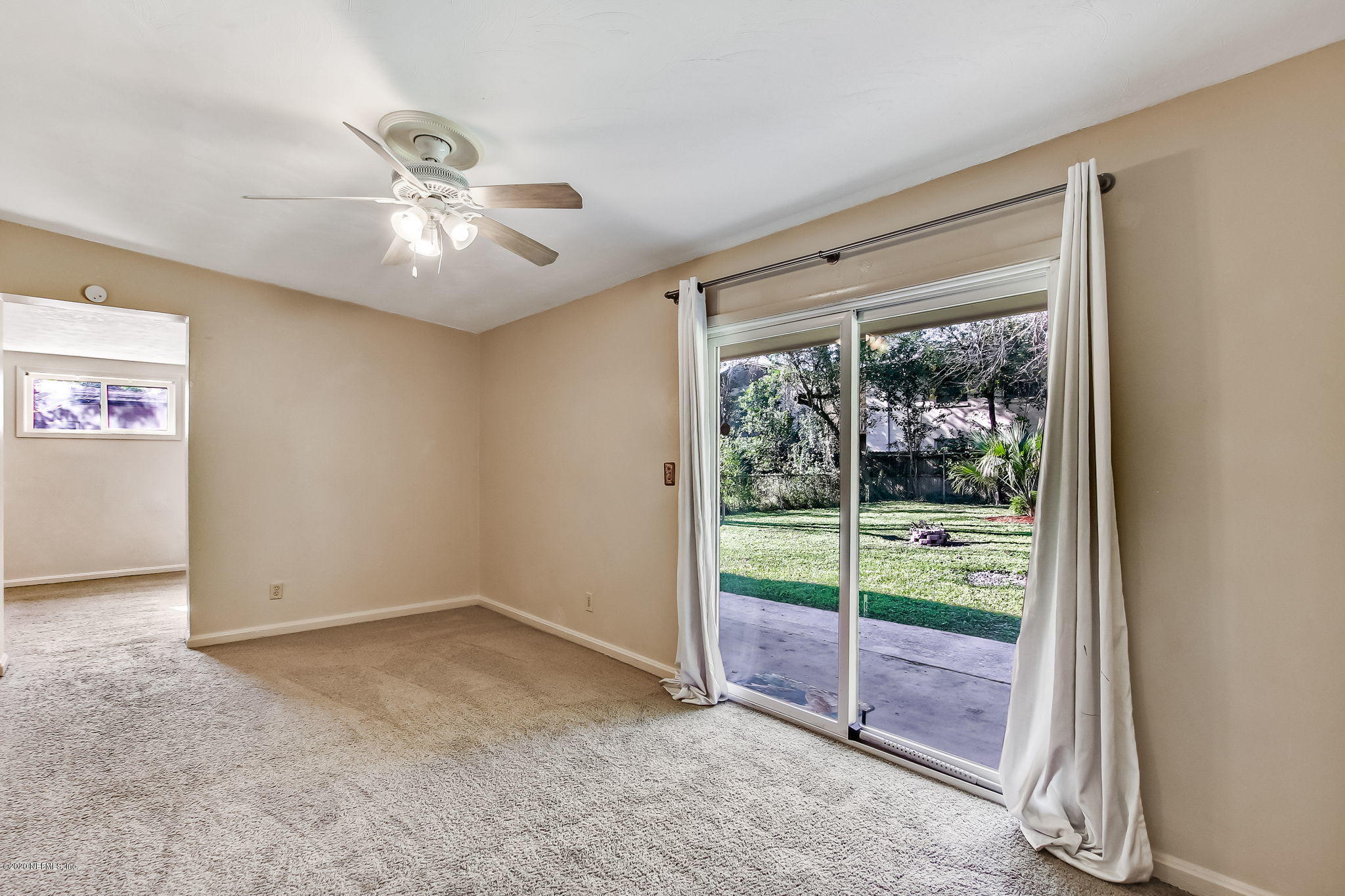6815 King Arthur Road Jacksonville, FL 32211 - Photo 15 of 32 a view of an empty room with a window