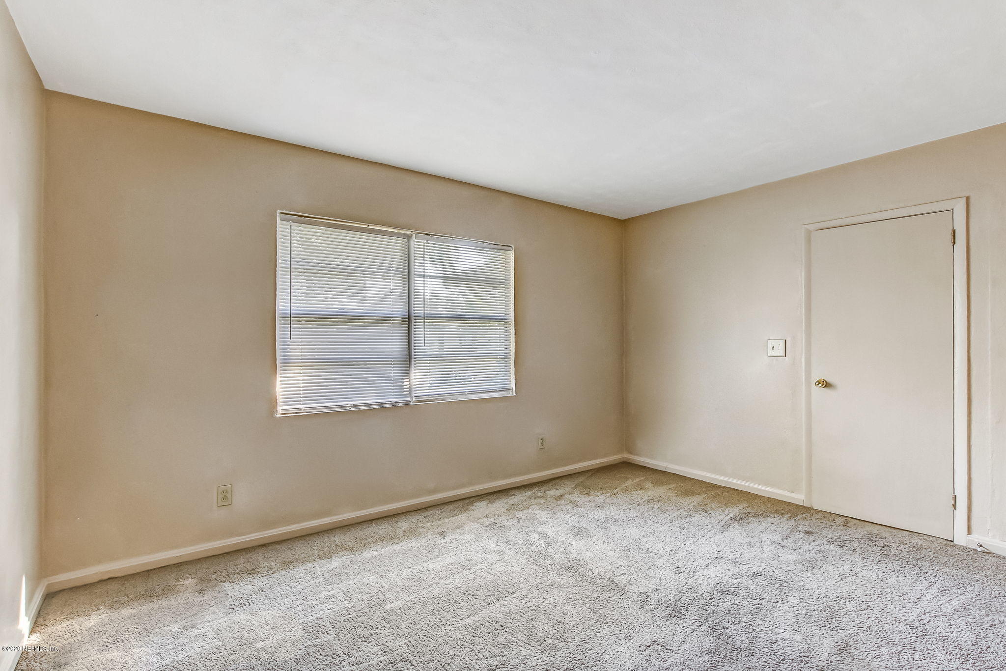 6815 King Arthur Road Jacksonville, FL 32211 - Photo 19 of 32 an empty room with windows