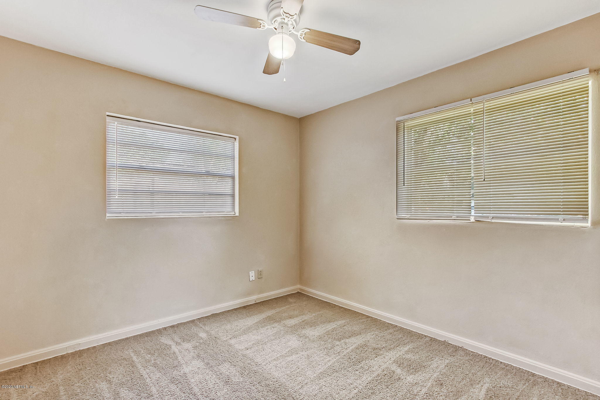 6815 King Arthur Road Jacksonville, FL 32211 - Photo 25 of 32 a view of an empty room with a window