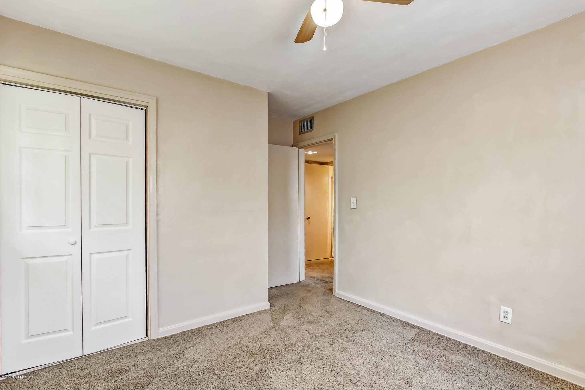6815 King Arthur Road Jacksonville, FL 32211 - Photo 26 of 32 an empty room with a empty space and windows