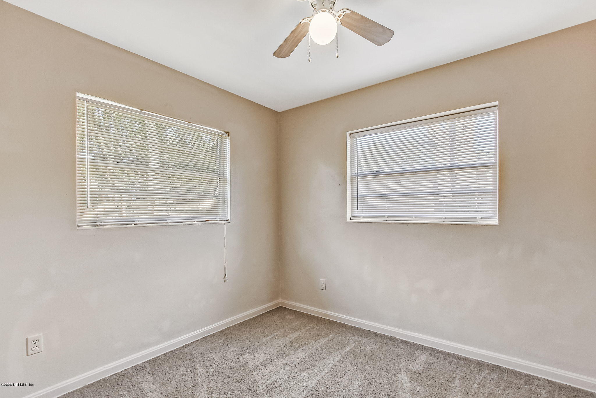 6815 King Arthur Road Jacksonville, FL 32211 - Photo 27 of 32 an empty room with a window