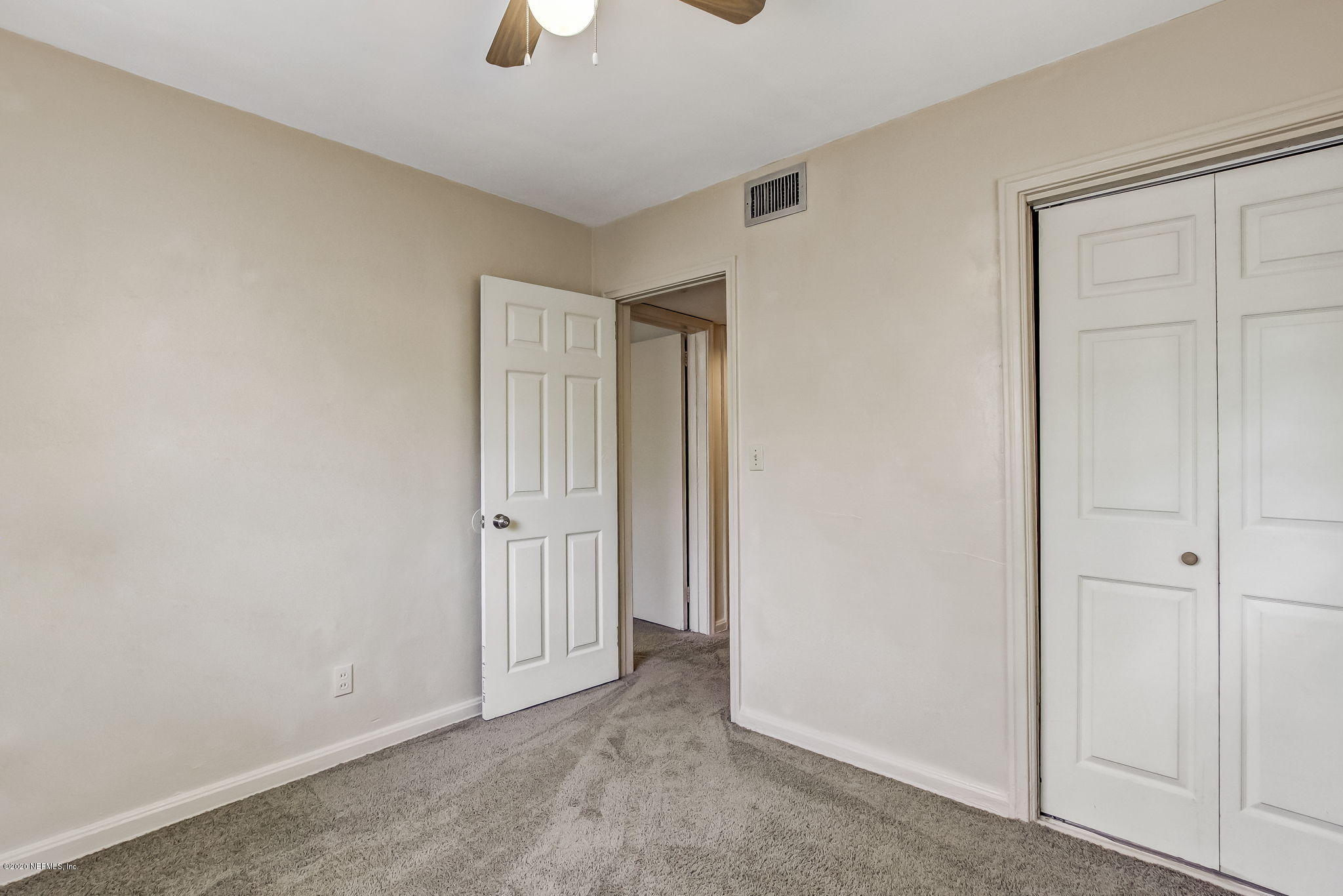 6815 King Arthur Road Jacksonville, FL 32211 - Photo 28 of 32 an empty room with ceiling fan