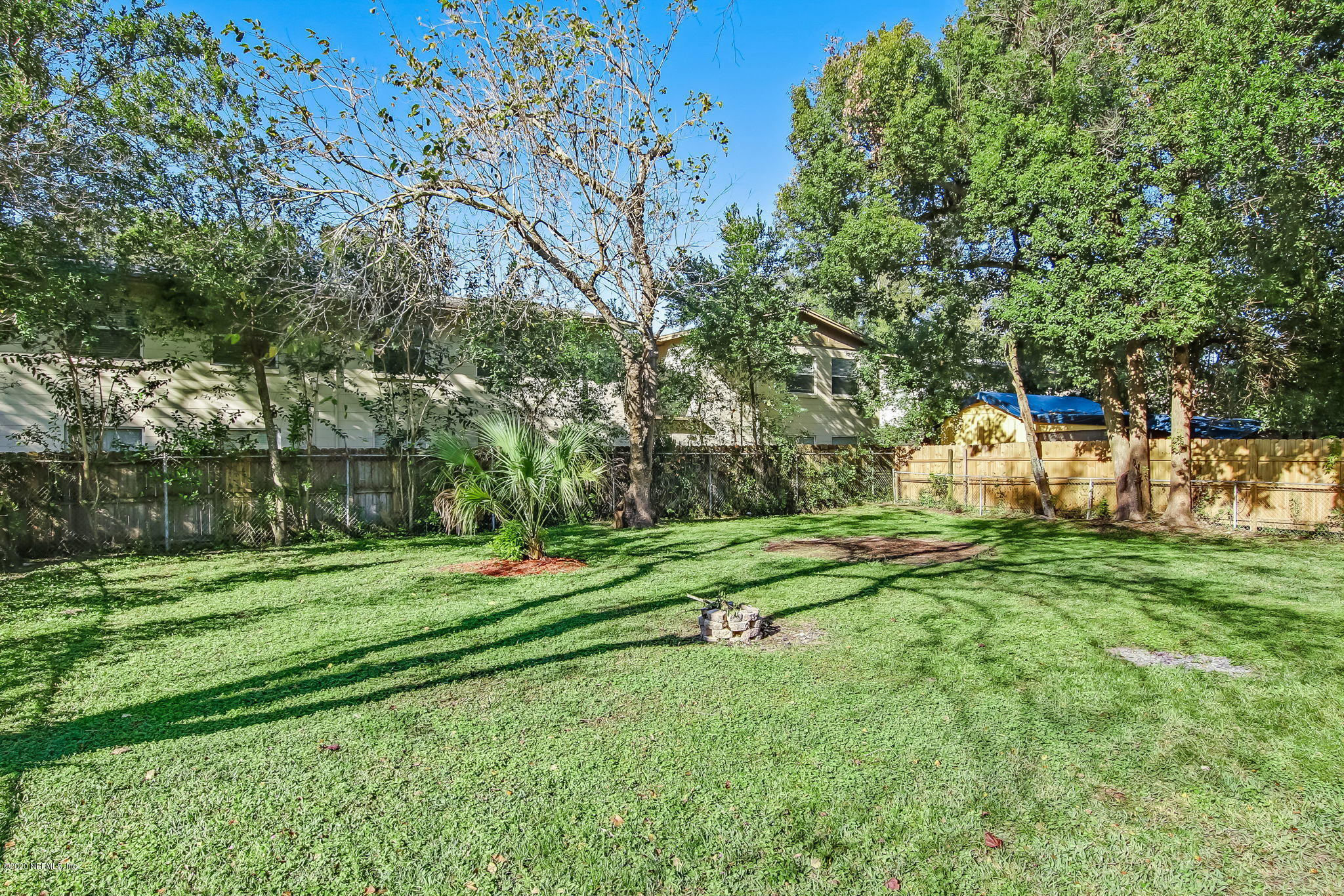 6815 King Arthur Road Jacksonville, FL 32211 - Photo 31 of 32 a garden view with a sitting space